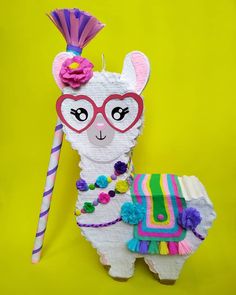 a llama made out of paper and some decorations