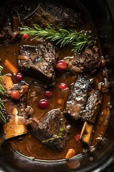 a pot filled with meat and vegetables on top of a stove