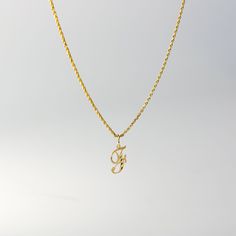 A timeless piece that will never go out of style. This 14K gold calligraphy pendant is the perfect and most stunning way of keeping a name close to your heart. We handmade each piece so you can assure you're getting a one-of-a-kind pendant that is not like any other. This 14K solid gold letter pendant is flawlessly crafted to look super chic and elegant around your neck. Pair it with a nice gold chain and wear it with almost all of your outfits. The piece is such a versatile lettering necklace. F Necklace, F Initial, G Necklace, G Initial, Gold Letter Pendants, Initial F, Initial G, Crystals Necklace, Pretty Jewelry Necklaces