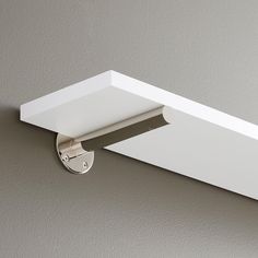 an overhead view of a light fixture on a wall in a room with gray walls