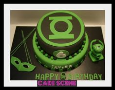 a green and black birthday cake with the number eight on it