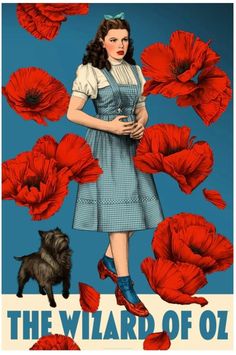 a woman standing in front of red flowers with the words, the wizard of oz on it