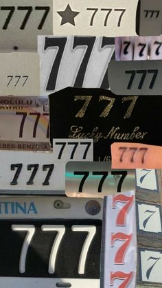 many license plates are stacked on top of each other with numbers and stars above them