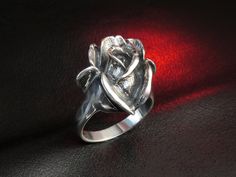 "Oxidized sterling silver rose ring. Hallmark: 925 Approximate weight: 8.1 g Width: 0.82 inches Shipping: - we prepare our orders ready for shipping in 3-7 business days, all items are made to order, they are not kept in stock; - we will provide tracking number as soon as order will be shipped. EXPRESS shipping: if you are interested in FAST delivery, we offer very fast and high quality \"door to door\" service by UPS Express. Delivery: within Europe - 1 business day, within USA, Canada and Aust Elegant Sterling Silver Rings With Roses, Formal Rose Colored Ring Jewelry, Formal Rose-colored Ring Jewelry, Formal Rose-colored Jewelry Ring, Formal Silver Jewelry With Rose Details, Elegant Silver Rings With Rose Details, Formal Flower Shaped Rings With Rose Design, Silver Rings With Rose Design For Formal Occasions, Formal Flower-shaped Ring With Rose Design