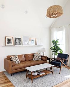 a living room with white walls and wood floors