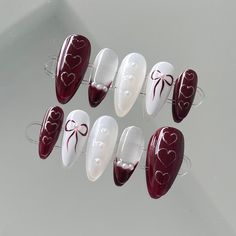 These are hand made, high quality, gel x press on nails. Each nail is meticulously painted and designed to provide salon quality manicure at home. With the right application, these nail tips can last up to two weeks and are easy to remove with warm soapy water.  📬Free tracked shipping on all orders over $55! Please see shipping info for more details on domestic and international shipping.  ❣️Style Description:  - Medium almond shape - Red and white Coquette design 📦What is included:  - Each set includes a full set of 10 press-on nails and a starter kit - The starter kit includes alcohol pads, cuticle pusher, mini nail file and a sheet of adhesive tabs (24 pieces)   ❕Please Note:  - Measure your nails before making an order as the correct size is crucial for a natural looking application. Cute Simple Red Nails, Vintage Red Nails, Red And White Coquette, Red Coquette Nails, Festive Holiday Nails, Nails Coquette, Nails Festive, Coquette Design, Red Coquette