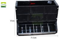 the bottom section of a black plastic container with metal bars on it and measurements for each compartment