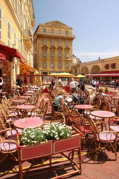 many tables and chairs are set up outside