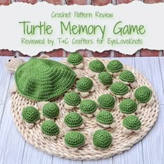 a green turtle sitting on top of a basket next to a sign that says turtle memory game