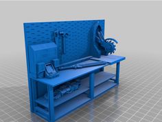 a blue work bench with some tools on it and a phone in the back ground