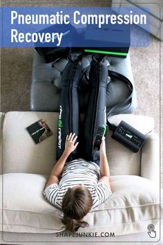 a person laying on top of a couch next to a bag