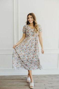 Pretty floral midi dress with a natural waist, v-neckline, button detailing, short side slits and short sleeves.

#modesty #modestclothing #modeststyle #modestwear #modestfashionblogger #modestootd 
#womenswear #dressesforwomen #dresses #modestboutique #modest

100% Polyester

Hand wash in cold.

 modest dresses, modest dress, modest midi, modest maxi, modest fashion, modest trendy dresses, modest boutique, modest attire, modest clothing, modest tops, modest skirts, modest shop, modest women's clothing store