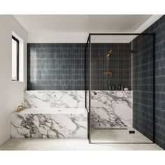 a bathroom with black and white marble walls