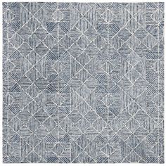 a blue and white rug with an abstract design