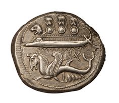 an ancient coin with a horse on it