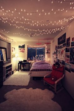 a bedroom with lights strung from the ceiling