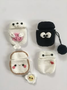 four crocheted items are shown on a white surface, one is black and the other is white