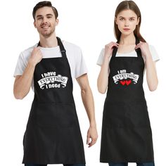 two people wearing aprons that say i have everything i need