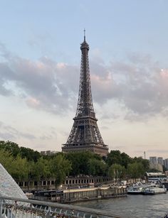 the eiffel tower is seen from across the river