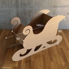 the cardboard sleigh is cut out and ready to be used as a decoration