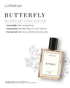 a bottle of butterfly perfume sitting on top of a table