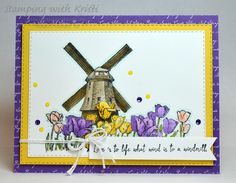 a close up of a card with a windmill and flowers on the bottom, along with words that read let's do what we need to be wonderful