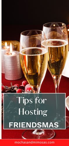 two glasses of wine sitting on top of a table next to a lit candle with the words tips for hosting friendsmass