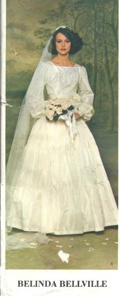 an old photo of a woman in a wedding dress