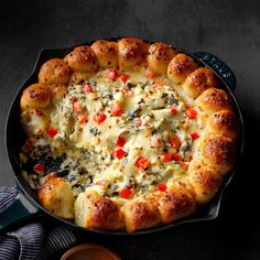 a cheesy dish in a cast iron skillet