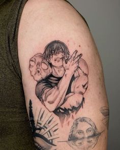 a man with a tattoo on his arm