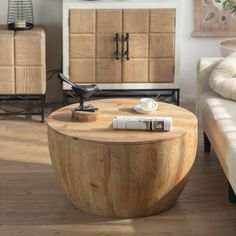 a living room filled with furniture and a wooden table