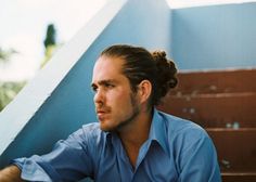 a man sitting at the bottom of some stairs