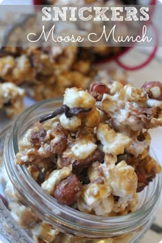 a glass jar filled with nuts on top of a table