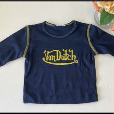 Nwot Von Dutch Kids Tee. Navy Tops With Letter Print For Spring, Navy Cotton Top With Letter Print, Navy Cotton Tops With Logo Print, Navy Cotton Tops With Letter Print, Blue Letter Print T-shirt For Fall, Navy Long Sleeve Top With Letter Print, Navy Long Sleeve Tops With Logo Print, Blue Long Sleeve Shirt With Letter Print, Fitted Blue Tops With Logo Print