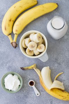 bananas, yogurt and other ingredients on a table