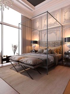 a bedroom with a four poster bed and chandelier