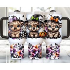 three mugs with dogs on them sitting next to each other