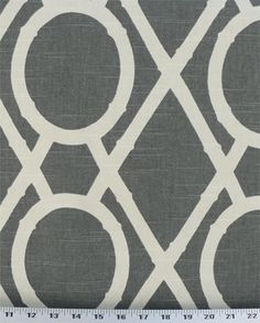 a gray and white fabric with circles on it