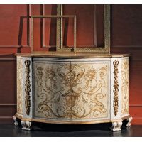 an ornate white and gold chest with mirror on it's top, in front of a red wall