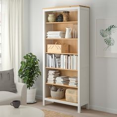 a living room with a book shelf filled with books