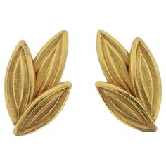 Pair of 18k yellow gold leaf motif earrings, by Greek designer Ilias Lalaounis. Earrings are 1.75" x 1". Marked: Greece, 750, A21, Maker's mark. Weight - 31.8 grams. Ilias Lalaounis Jewelry, Greek Pattern, Yellow Gold Diamond Earrings, Gold Leaf Earrings, 18k Gold Earrings, Swirl Earrings, Leaf Motif, Leaf Jewelry, Hammered Gold