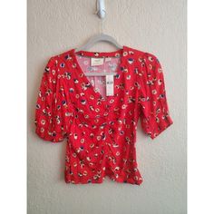 This Lovely Blouse From Maeve By Anthropologie Is A Must-Have For Any Fashion-Forward Woman. Featuring A Vibrant Red Color And A Beautiful Floral Pattern, This Blouse Is Perfect For Adding A Pop Of Color To Any Outfit. With Short Sleeves And Ruched Detailing, It Is Both Feminine And Comfortable. It Is A Size 2 And Has A Regular Fit, Making It Perfect For Many Body Types. The Blouse Has Never Been Worn And Comes With Tags Attached, Ensuring That It Is In Pristine Condition. Don't Miss Out On The Summer Red Ruched Top, Casual Red Ruched Top, Fitted Ruched Red Blouse, Spring Red Ruched Blouse, Red Ruched Blouse For Spring, Red Rayon Blouse For Spring, Red Floral Print Rayon Blouse, Bow Detail Dress, Lace Inset