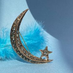 ● Are you looking for the perfect gift for yourself or your loved one? Our Crescent and Star Brooch, designed with crystal stones on bronze, may be the perfect choice for you. ● This Crescent and Star brooch is inspired by the Moon that illuminates us at night and the Stars that shine brightly in the sky, and is decorated with black crystal stones on bronze. Its width is 4 cm and its height is 6.5 cm, which makes it a statement piece that adds elegance and sophistication to any outfit. ● Our product design is a product of Tansel Baybara's Diplomatic Heritage Collection. The brooch is meticulously handcrafted and the black crystal stones are hand-set by women, making our brooch a perfect piece of jewellery. ● Your Crescent and Star Brooch will arrive in a special velvet box, ready to be giv Star Brooch, Wedding Brooch, Crystal Stones, Pool Water, Crystal Brooch, Heritage Collection, Perfume Spray, Crystal Stone, Diamond Crystal