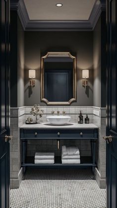 a bathroom with two sinks, mirrors and lights on the wall next to each other