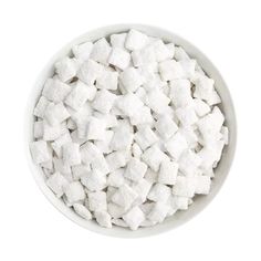 white sugar cubes in a bowl on a white background