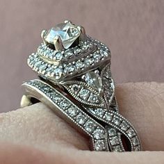 a close up of a person's hand with a ring on top of it