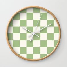 a clock with green and white checkered pattern