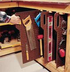 a workbench with tools in the drawer