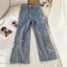 Slide into style with these Luminary Ribbed Star Denim by Bella Chix straight-leg jeans! Looks that light up any room, these jeans will make you feel like a celebrity with their unique ribbed star design. Perfect for any occasion, these jeans will give your look the standout flair it needs! So go ahead, strut your stuff! Product Specifications Wash: Distressed, Bleach Wash Waist Type: High Length: Ankle-Length Pants Jeans Style: Wide Leg Pants Elasticity: Non-Stretch Closure Type: Zipper Fly Kin Patch Jeans, Blue Flare Jeans, Harajuku Women, Denim Decor, Retro Jeans, Streetwear Jeans, Jean Large, Jean Vintage, Middle Age Fashion