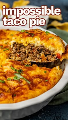 a close up of a casserole in a white dish